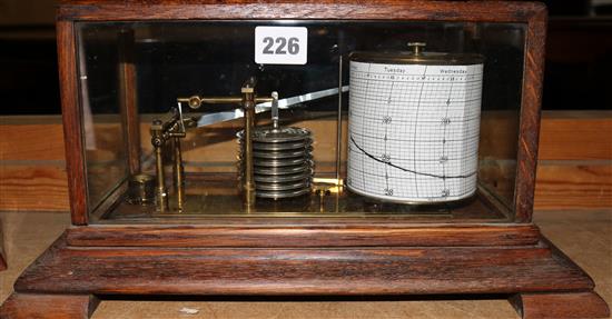 An oak case barograph